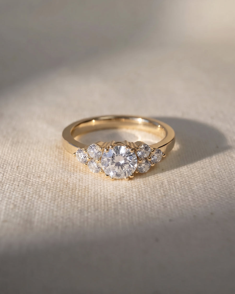 18ct yellow gold engagement ring with a round cut lab grown diamond and trefoil claw setting.