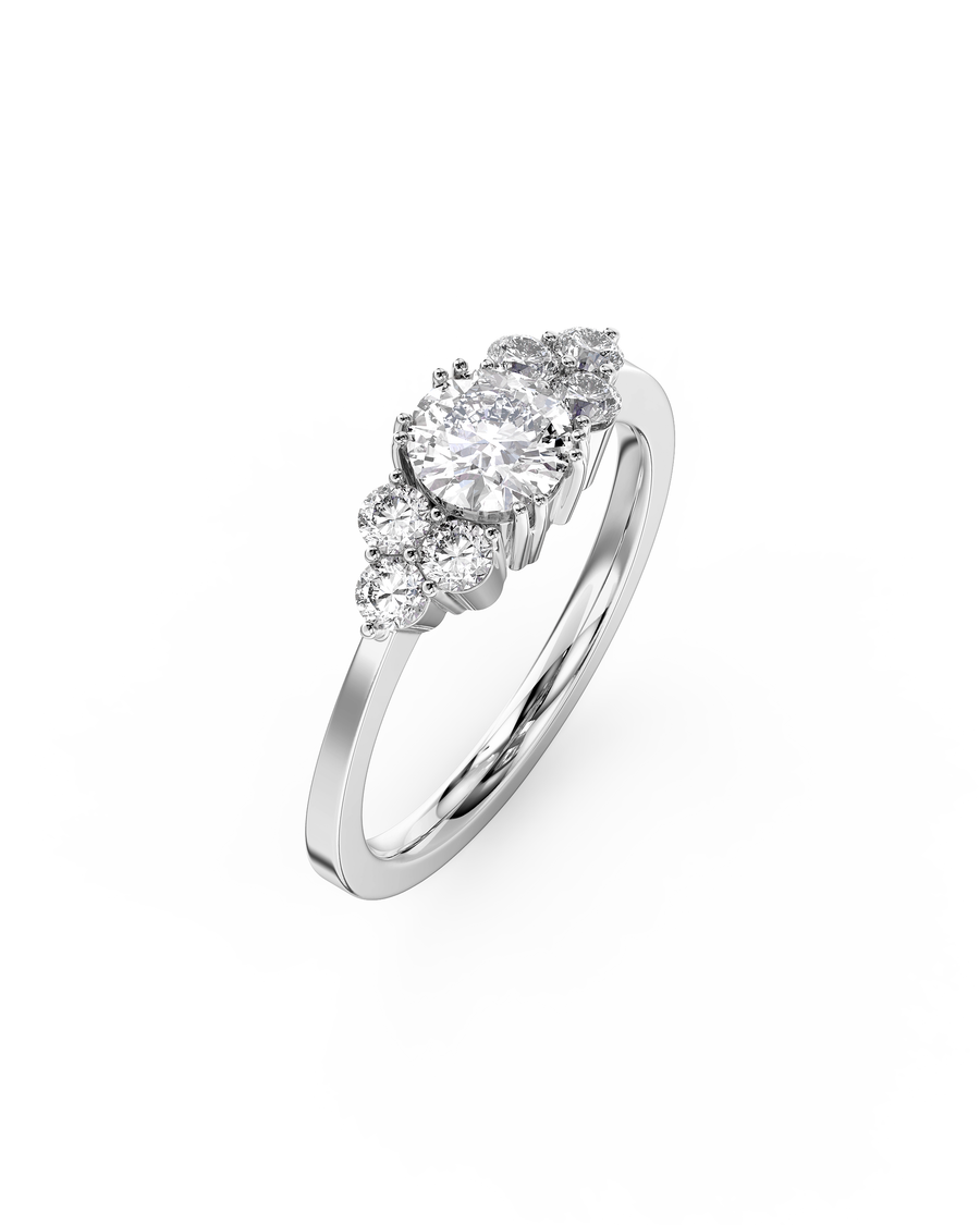 Silver round cut trefoil claw engagement ring with diamonds.