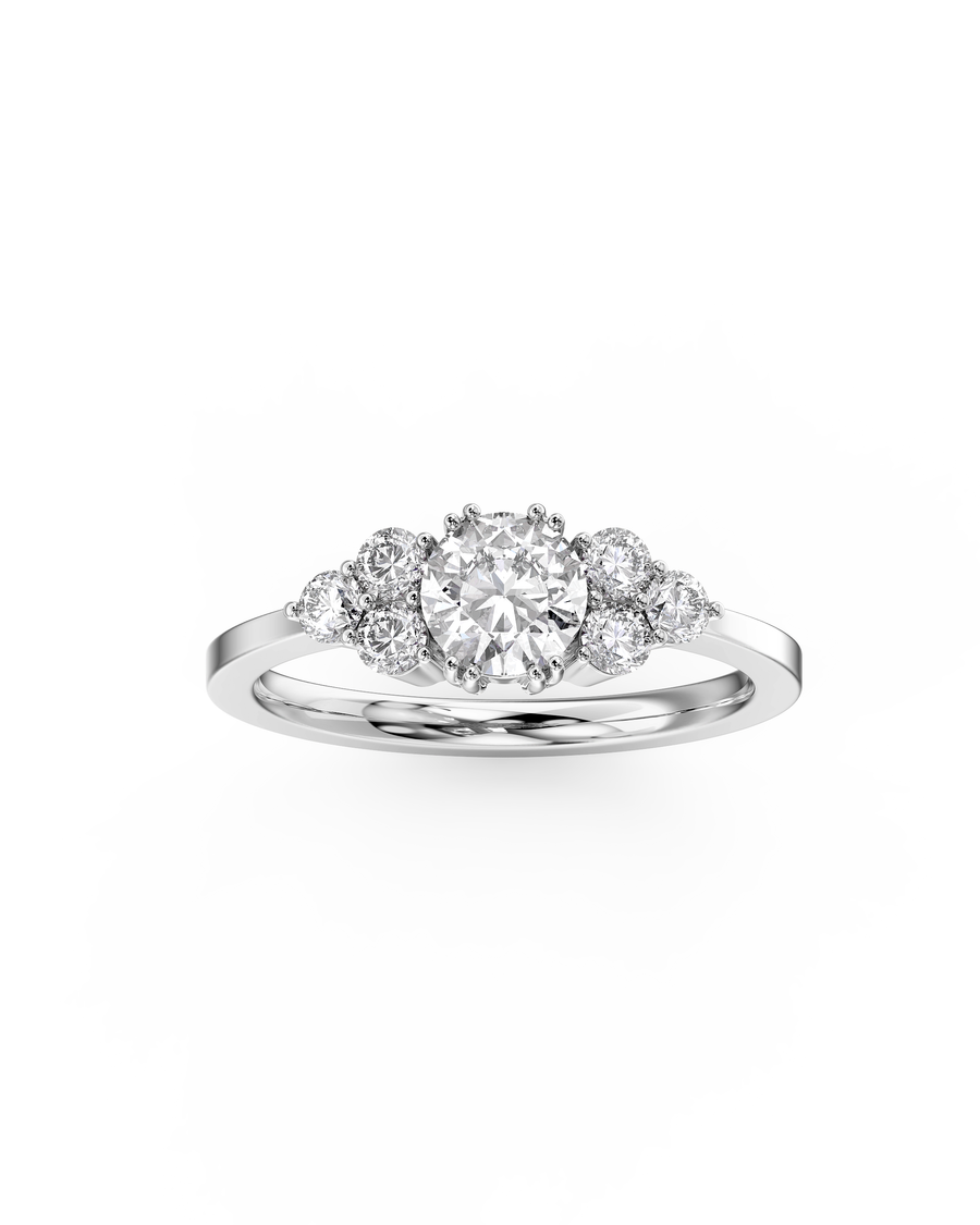 Silver round cut trefoil claw engagement ring with diamonds.