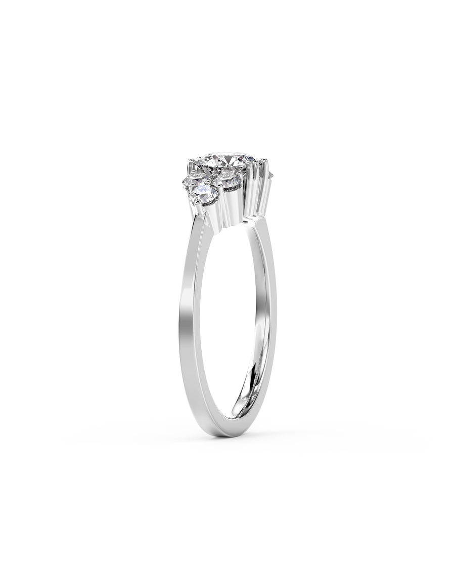 Silver round cut trefoil claw engagement ring with diamonds.