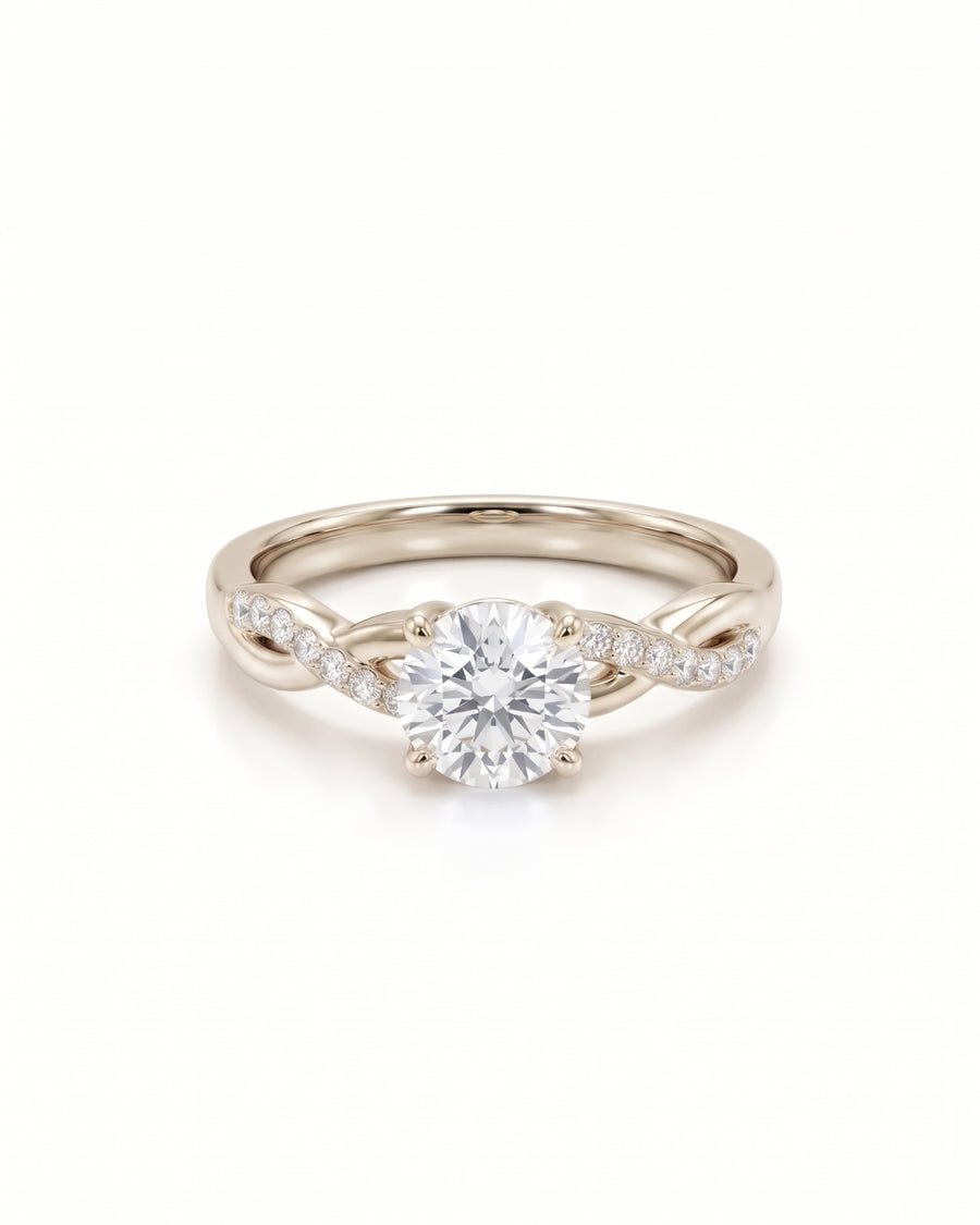 Round cut diamond engagement ring in 9ct white gold with a twisted band and claw setting.