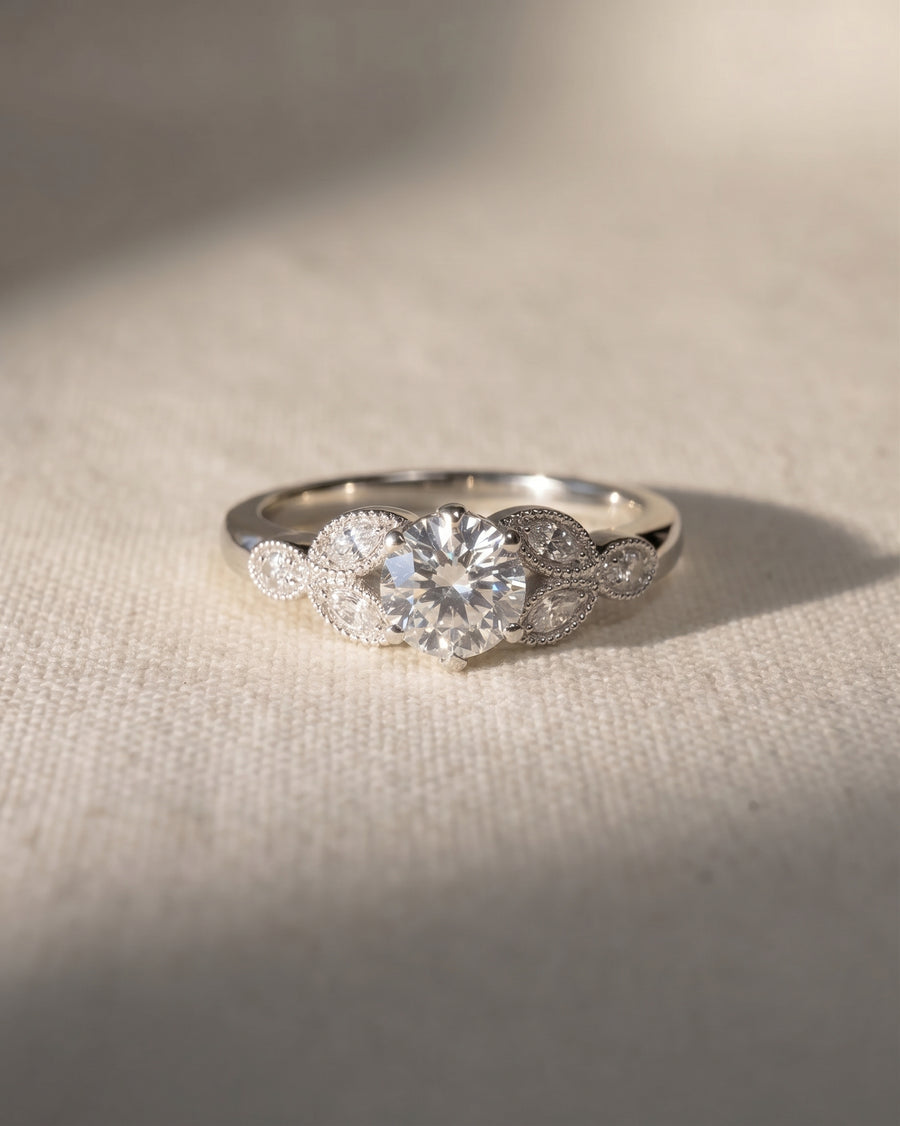 Platinum round cut vintage engagement ring with lab grown diamonds.