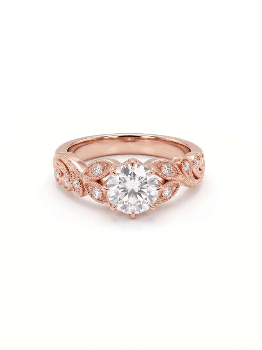 Round cut diamond engagement ring in 18ct rose gold with vintage leaf-inspired filigree and pavé accents.