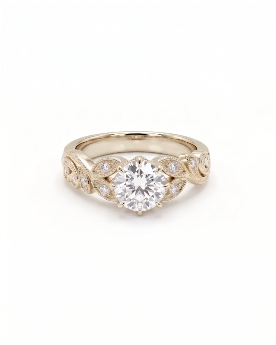 Round cut diamond engagement ring in 9ct white gold with a vintage leaf-inspired band design.