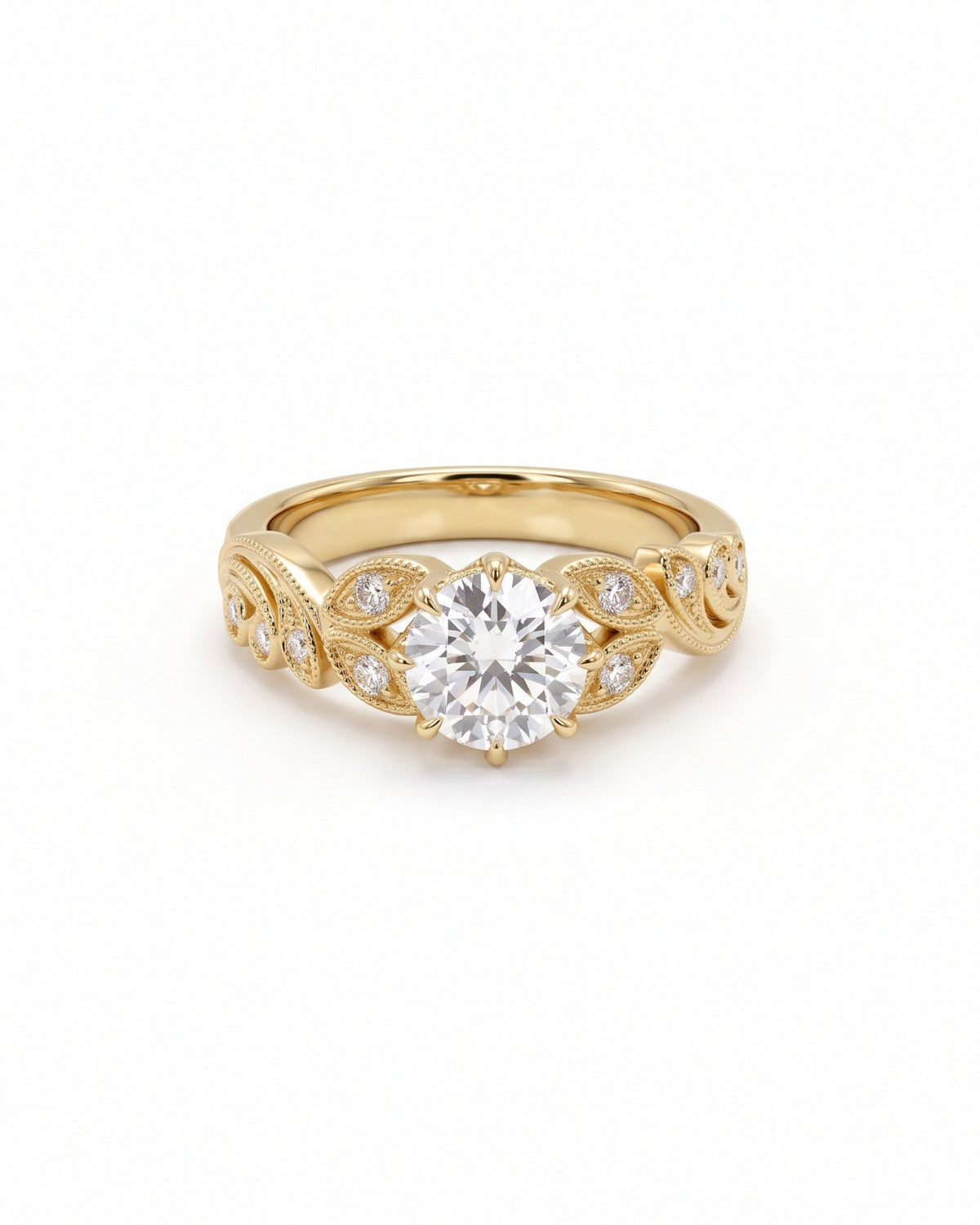 Round cut diamond engagement ring in 18ct yellow gold with vintage-inspired leaf filigree and side stones.