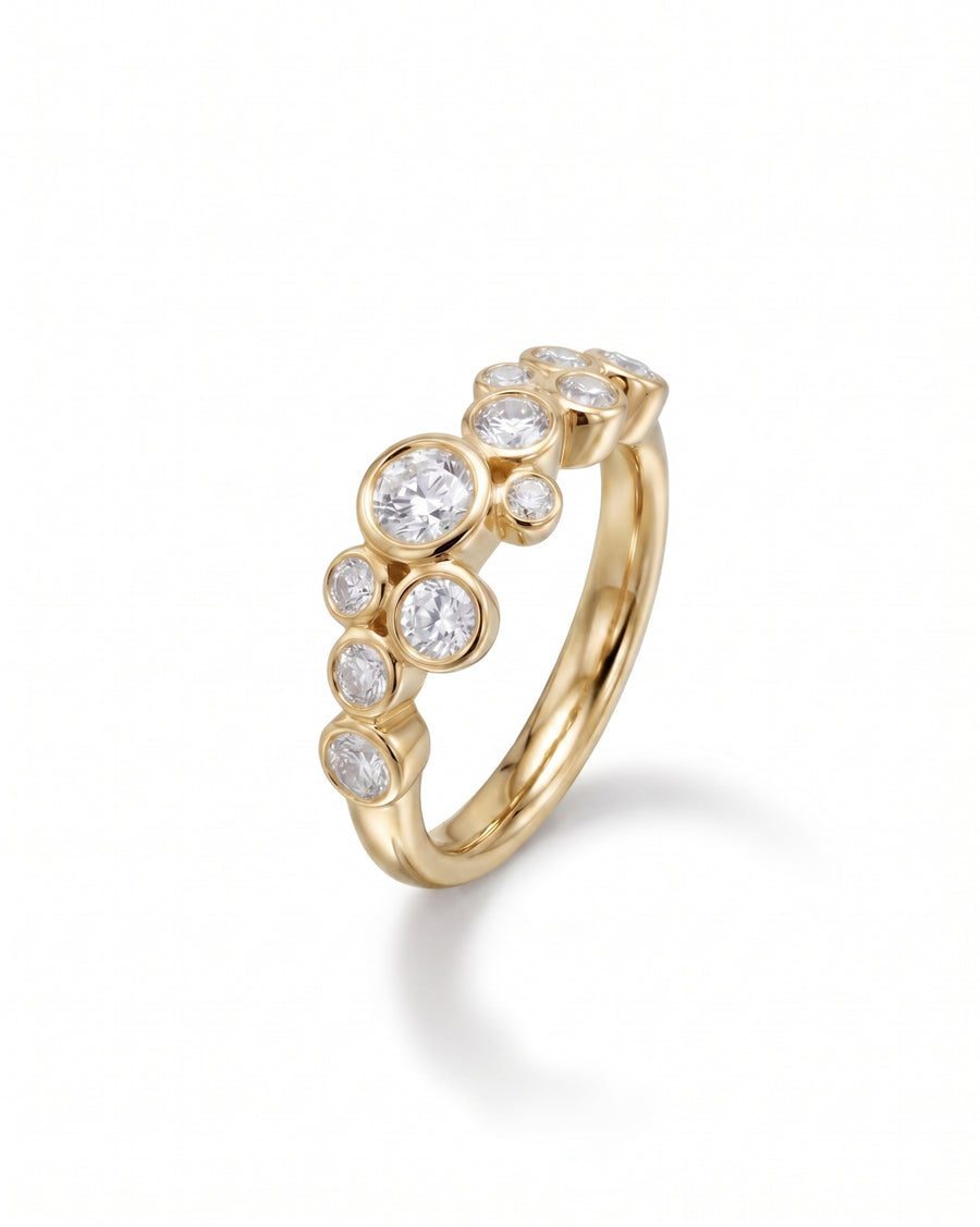 Gold ring with round cut diamonds in a bubble design.