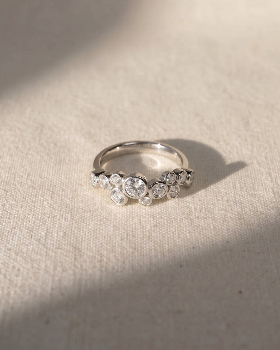 Platinum round cut water bubbles engagement ring with natural diamonds.