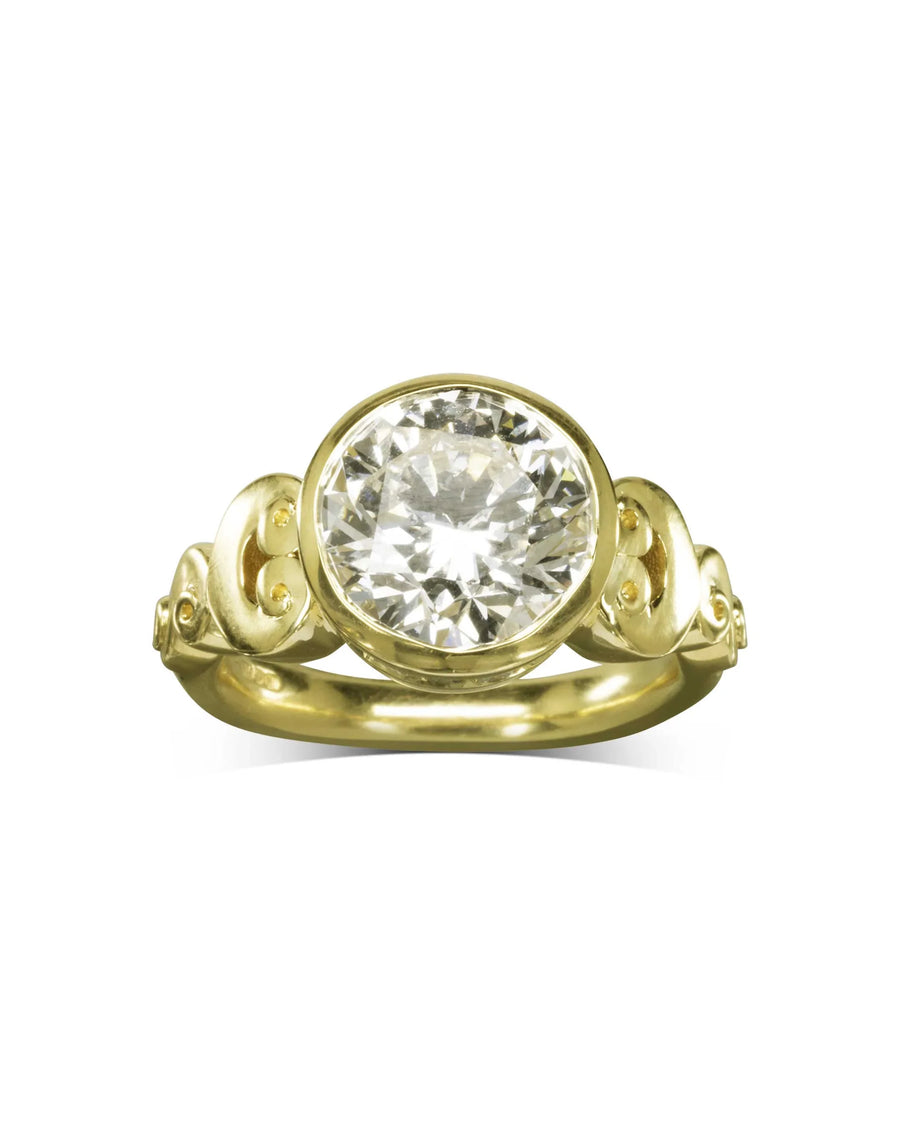 Yellow gold engagement ring with an oval rub over diamond.
