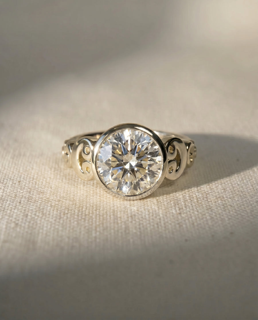 9ct white gold rub over diamond engagement ring with decorative scrollwork.
