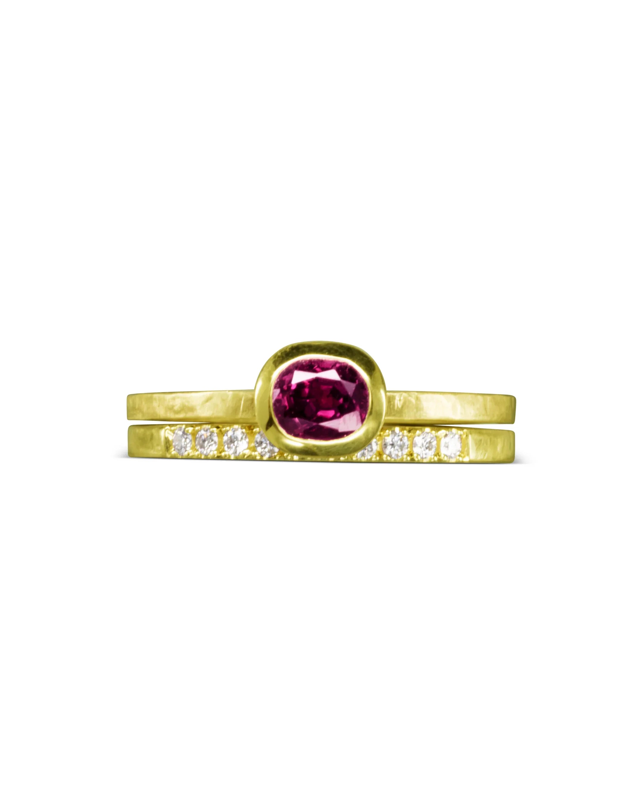 Handmade gold ring set with a vibrant ruby and diamond accents, showcasing artisanal texture
