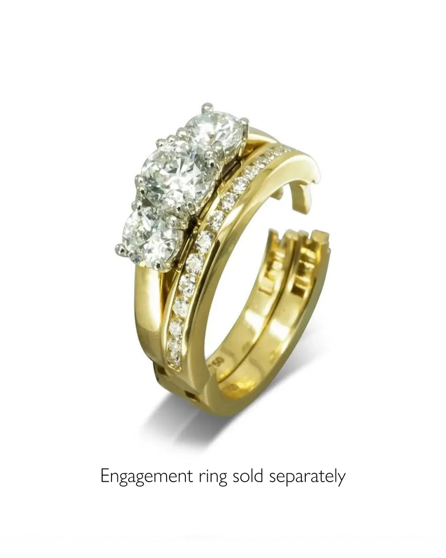 Gold channel set diamond hinged eternity ring with three round diamonds.