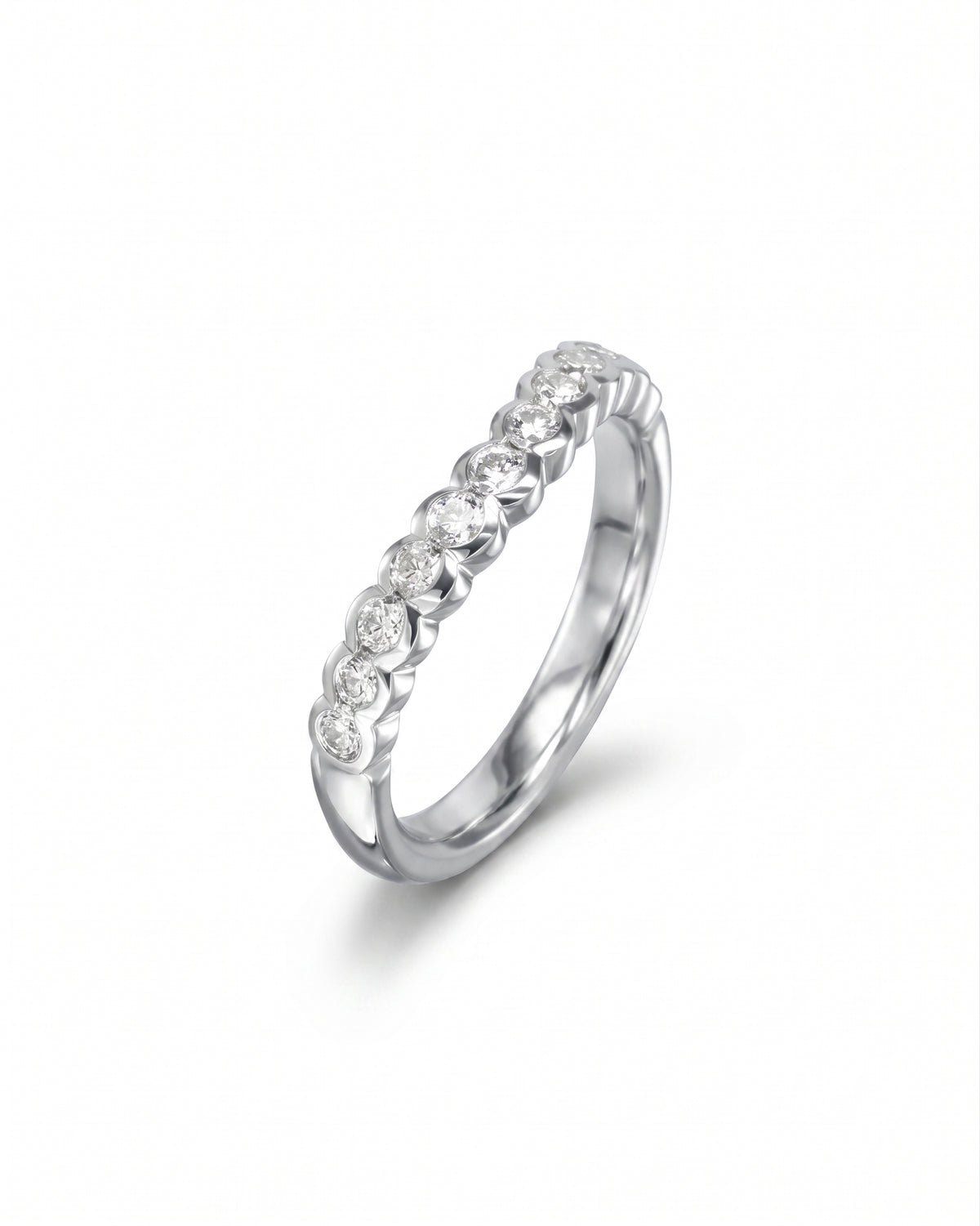 Platinum wedding band with a scalloped design featuring a row of round lab-grown diamonds.