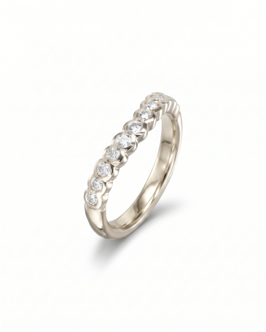9ct white gold wedding band featuring a row of scalloped lab-grown diamonds in a curved setting.