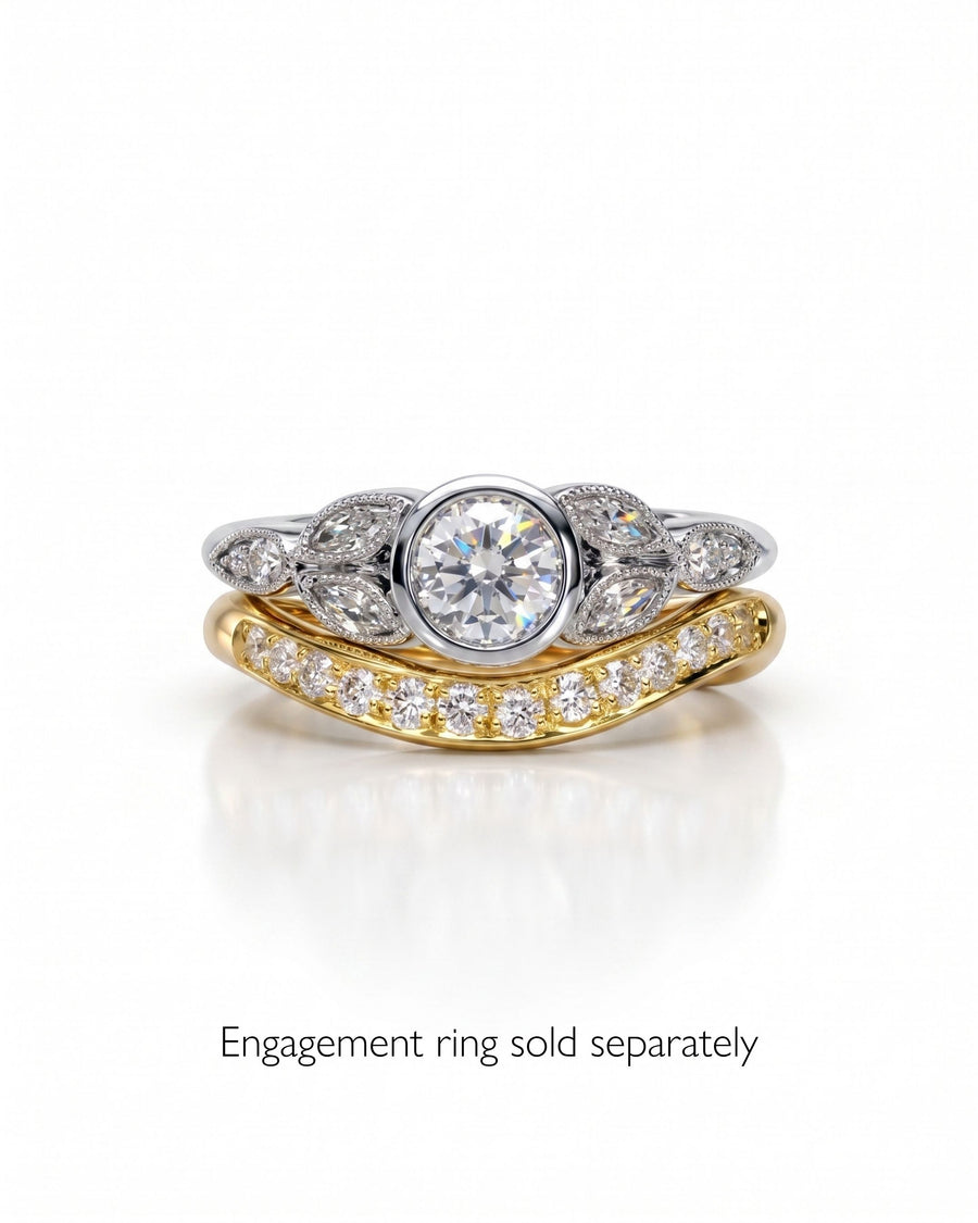 Gold shaped pave set diamond ring with a silver diamond engagement ring.