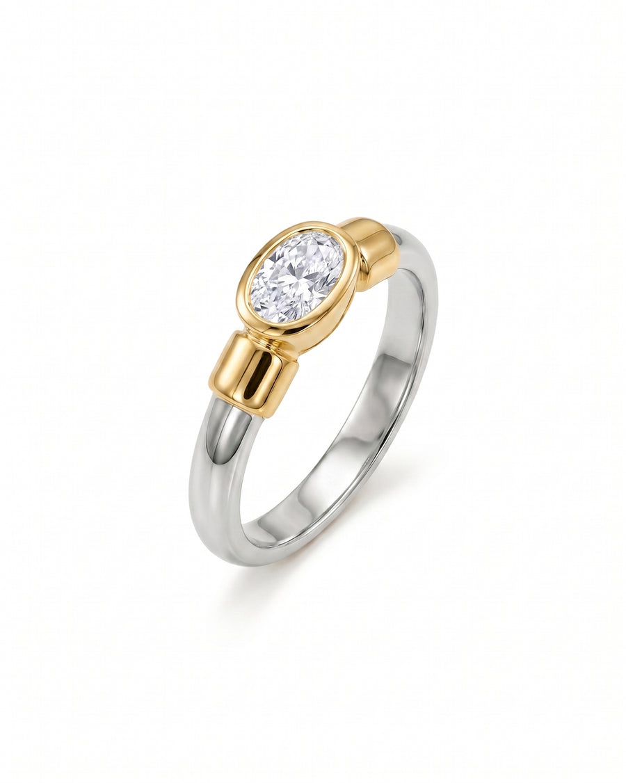 Mixed metal oval diamond ring.