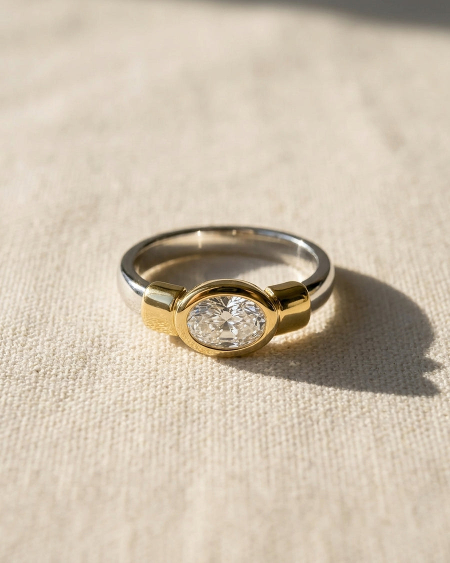Platinum and 18ct yellow gold ring with an oval diamond.