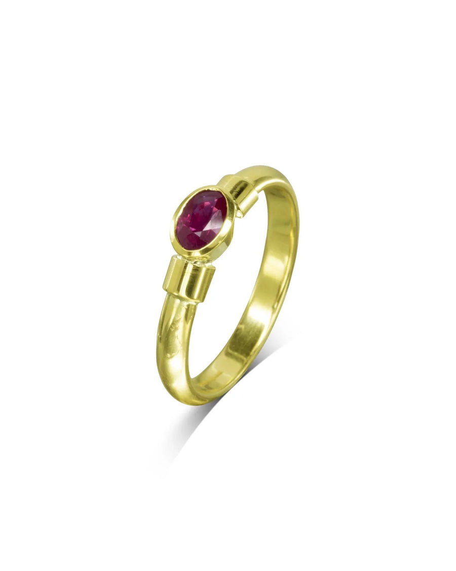 Gold ring with an oval ruby solitaire.