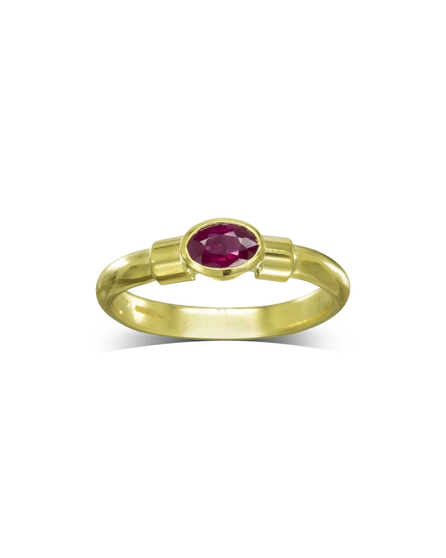 Gold shoulder oval ruby solitaire ring.
