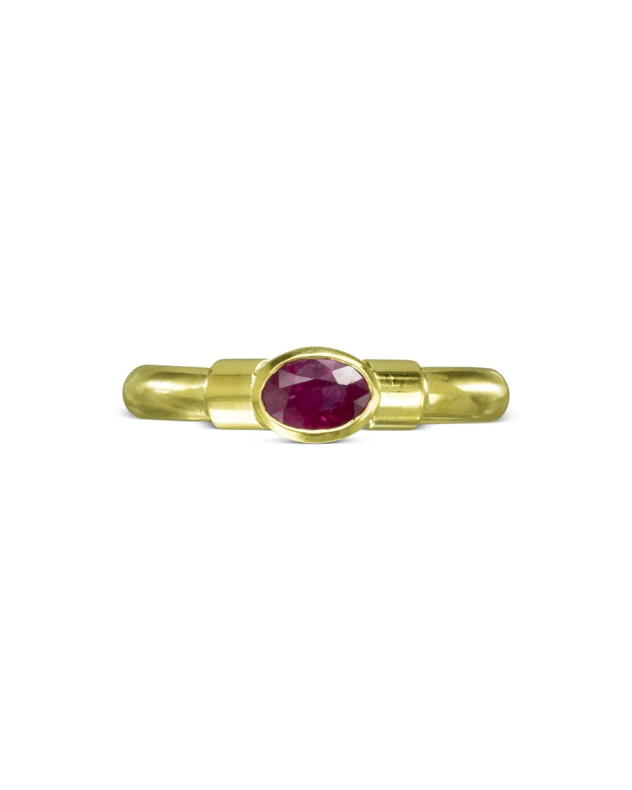 Gold shoulder oval ruby solitaire ring.