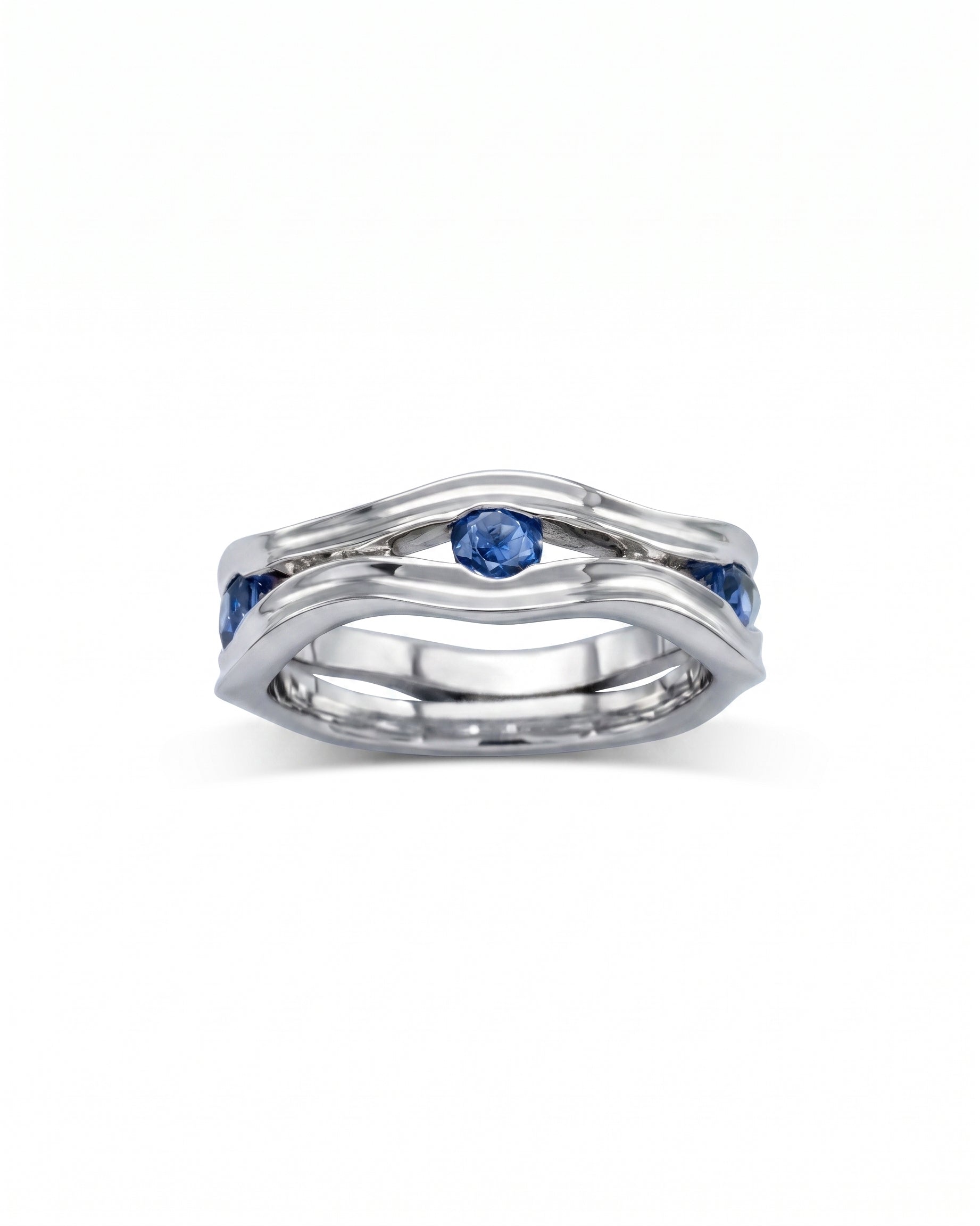 Silver hammered eternity ring with blue birthstones.
