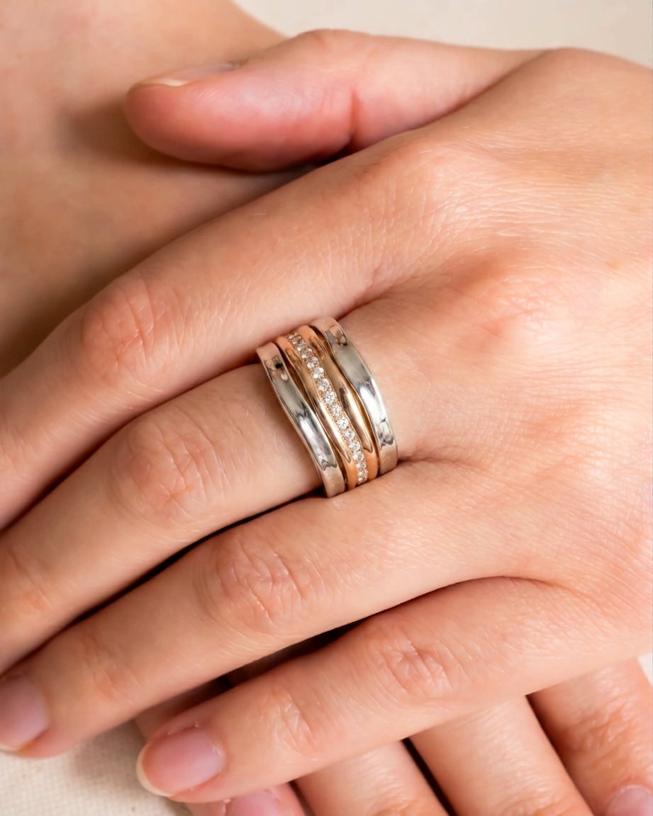 Side hammered mixed metal rose gold and diamonds eternity ring.