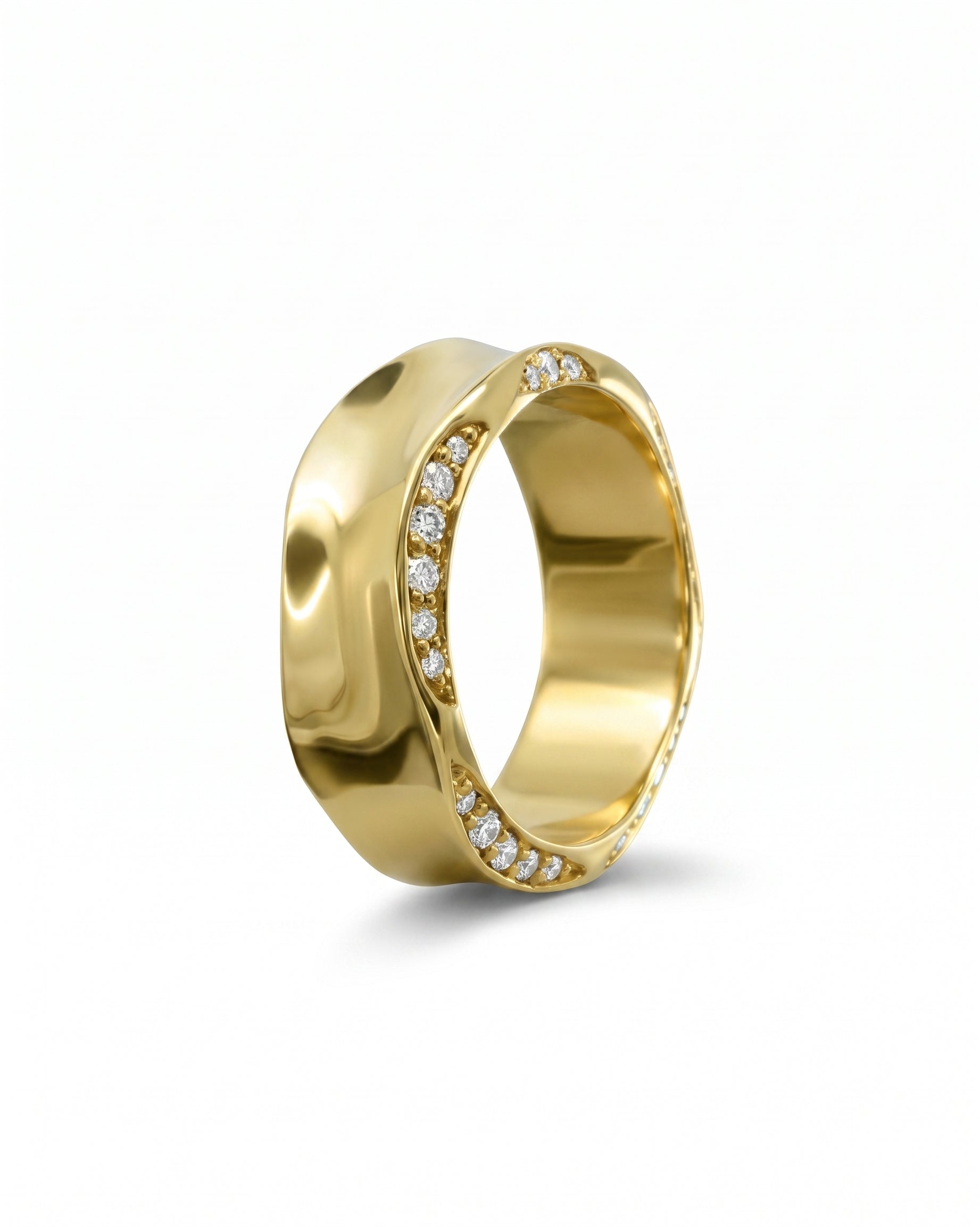 Gold eternity ring with side hammered edge and diamond accents.