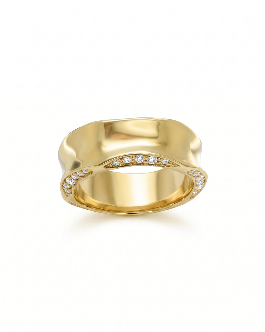 Gold eternity ring with side hammered edge and diamonds.
