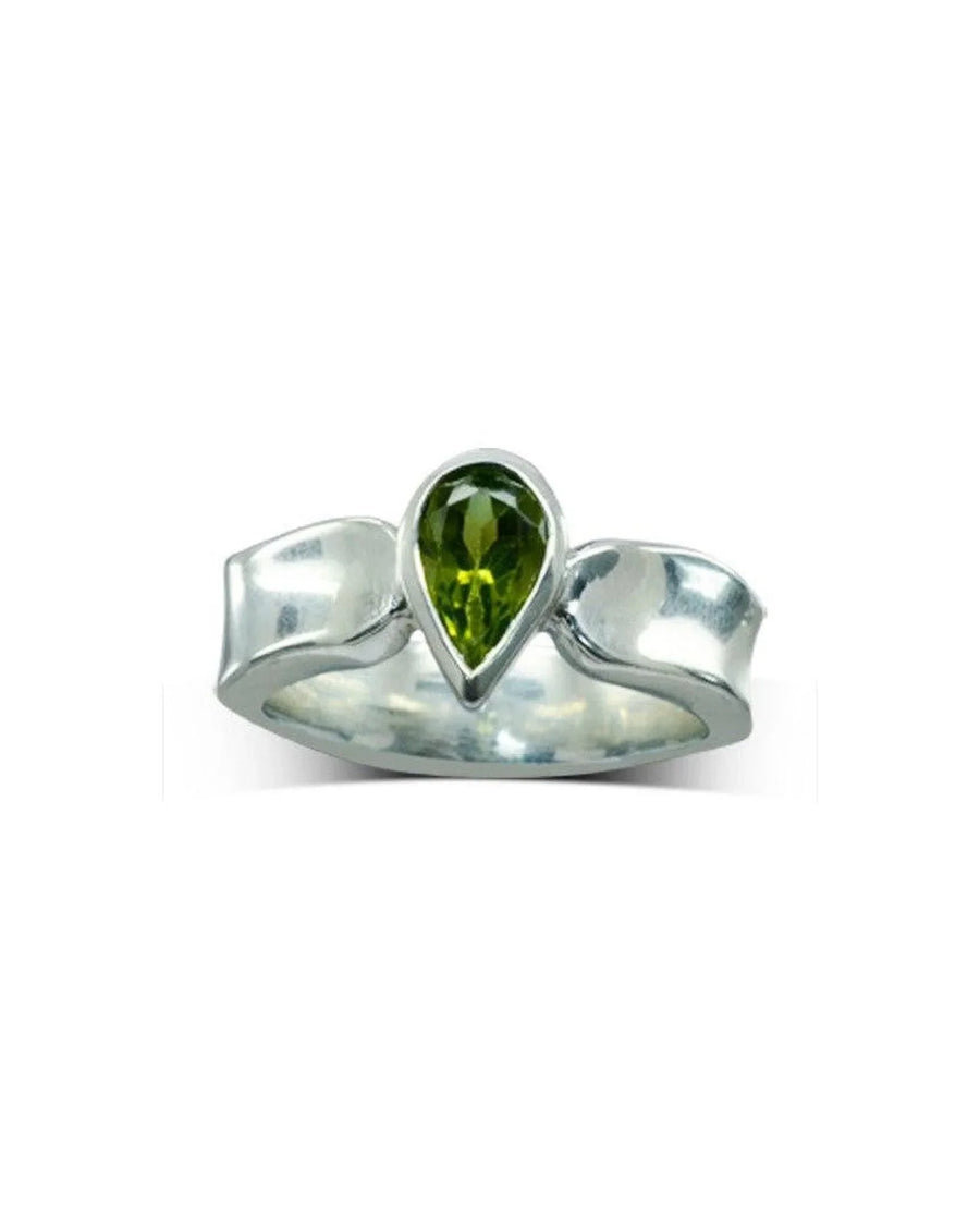 Silver side hammered ring with a pear-shaped green gemstone.