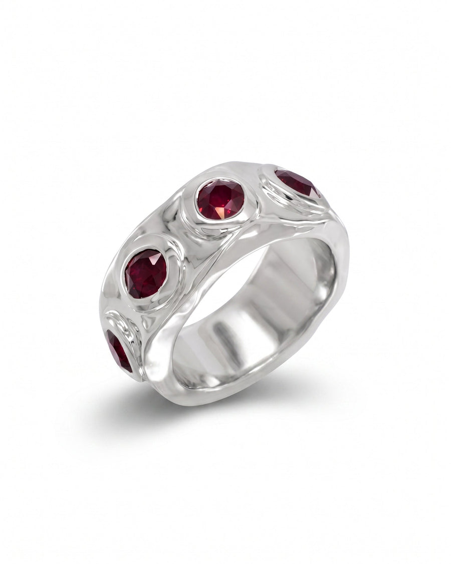Side hammered 9ct white gold eternity ring with five round rubies.