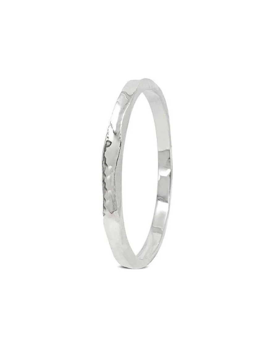 Handmade hammered solid silver bangle with organic textured design on white background