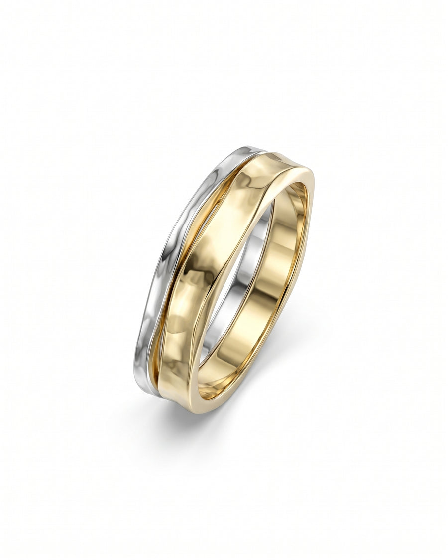 Two-tone gold and silver wedding ring featuring a hammered texture on the side bands.