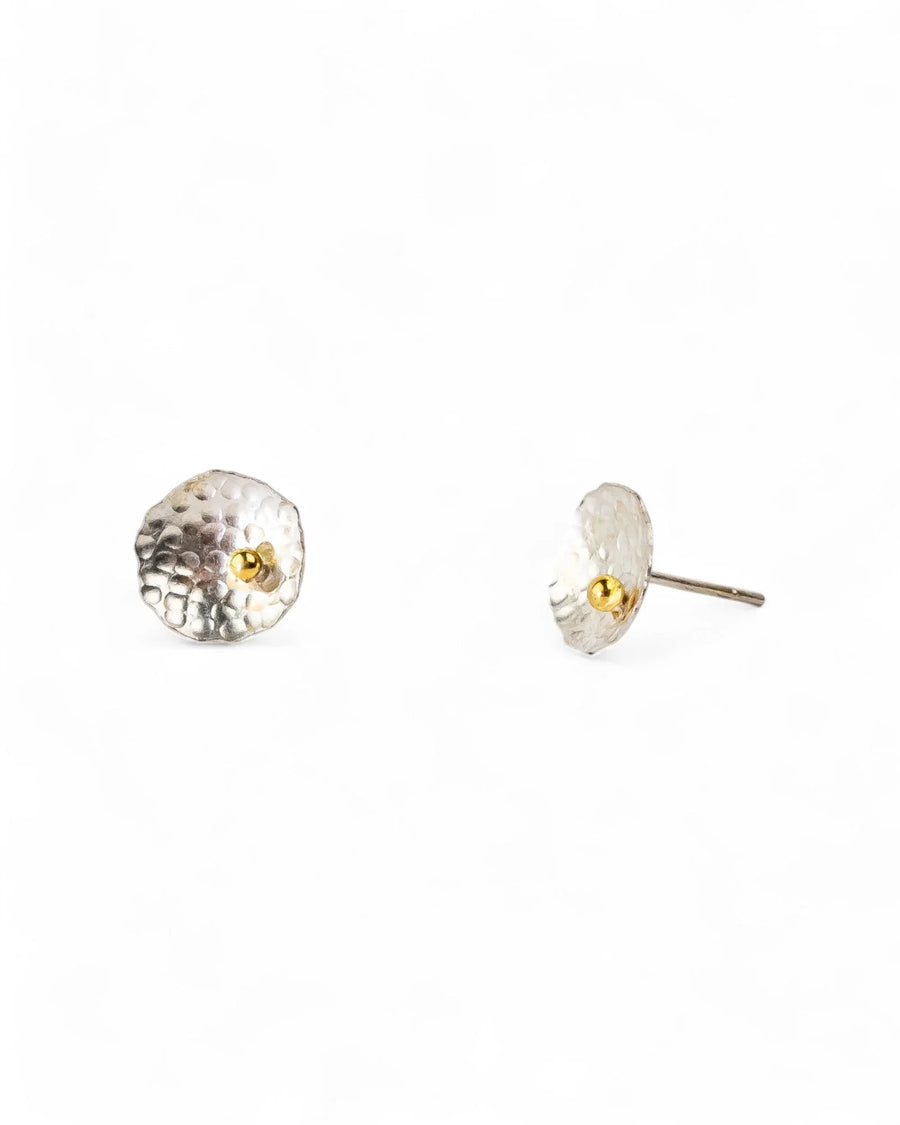 Silver hammered stud earrings with a small gold bead center.