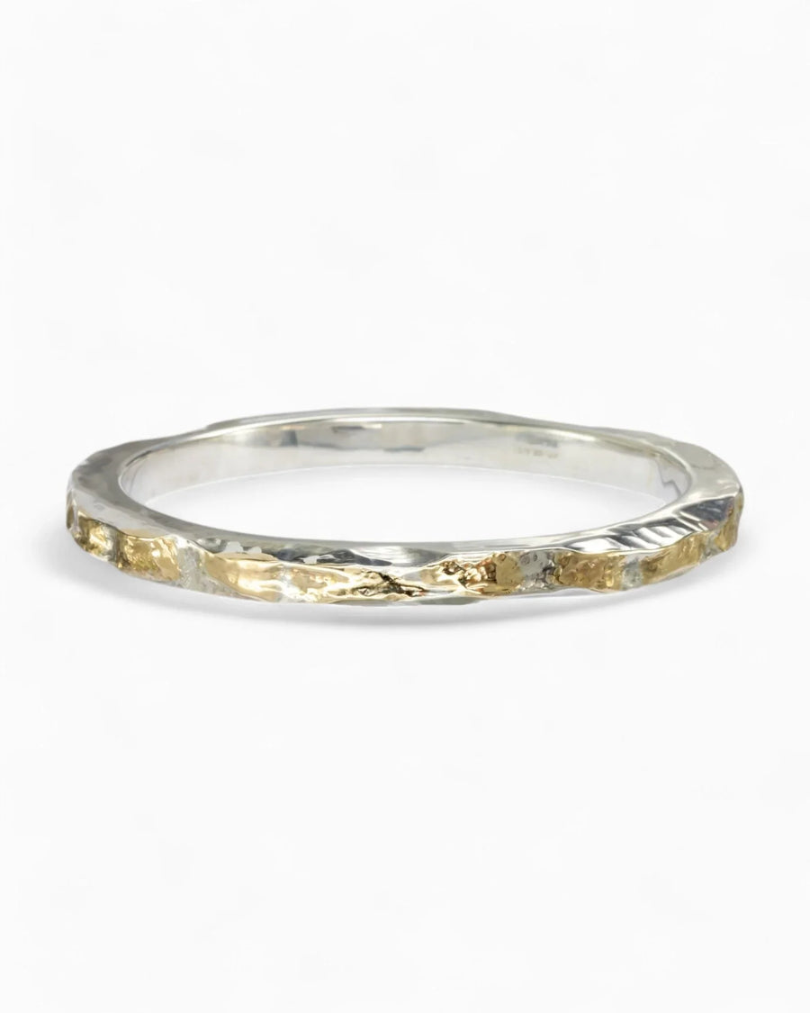 Silver and gold hammered bangle.