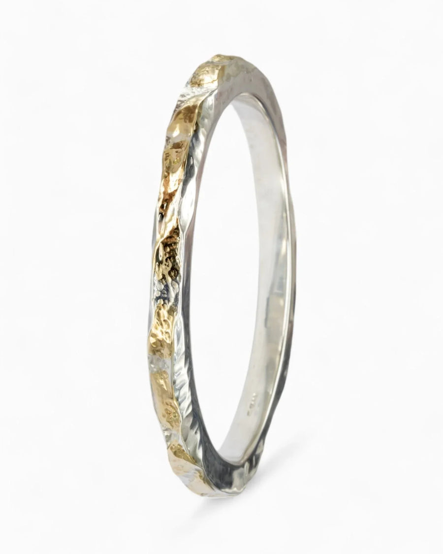 Silver and gold hammered bangle.