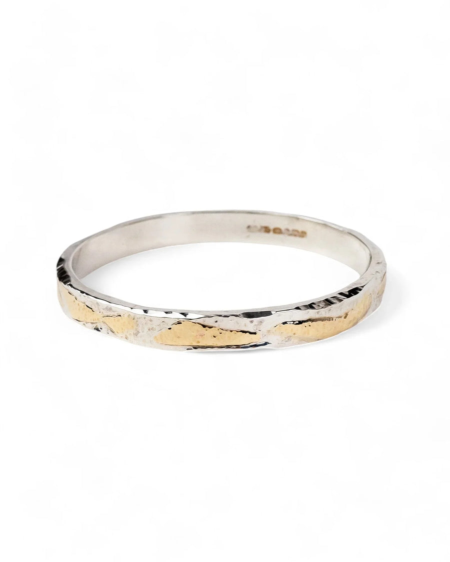 Silver and gold hammered bangle.