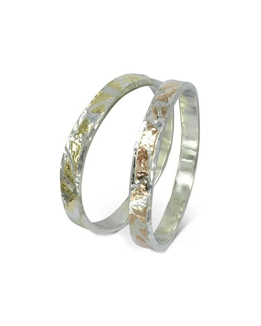 Silver and gold hammered bangles.