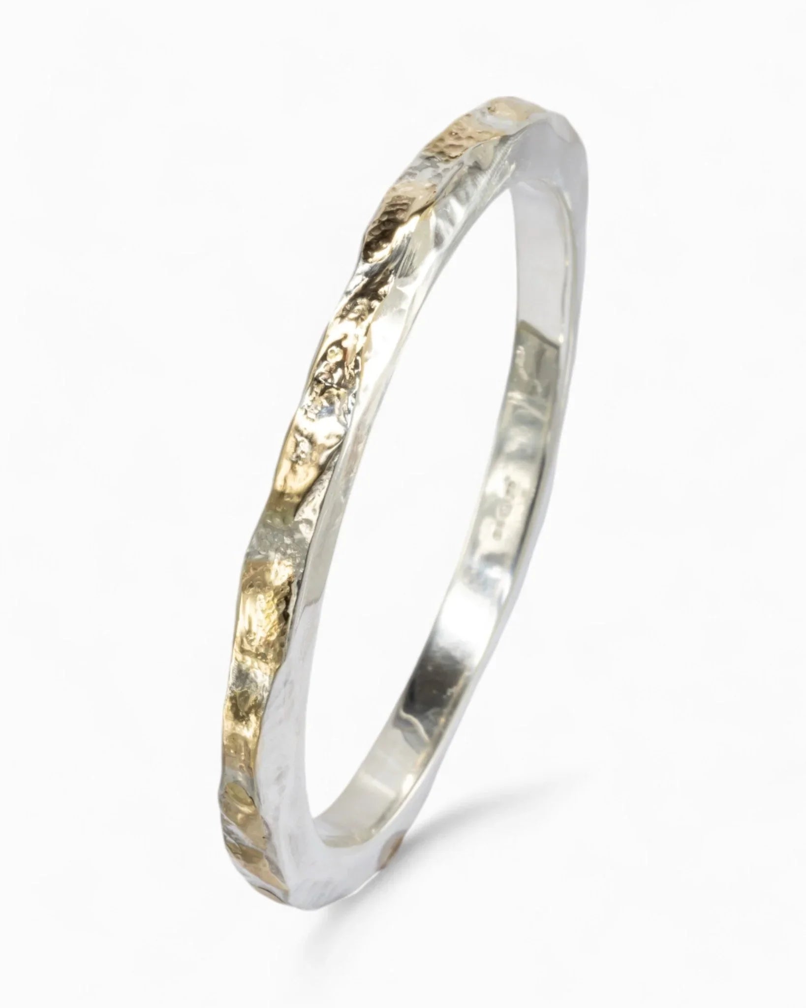 Silver and 9ct yellow gold hammered bangle.