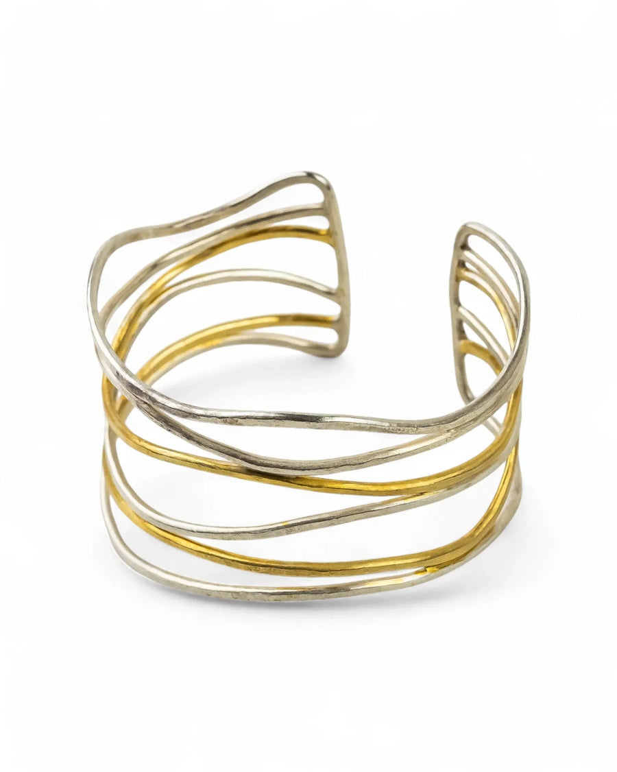 Six strand silver and gold cuff bangle with an open, hammered texture design