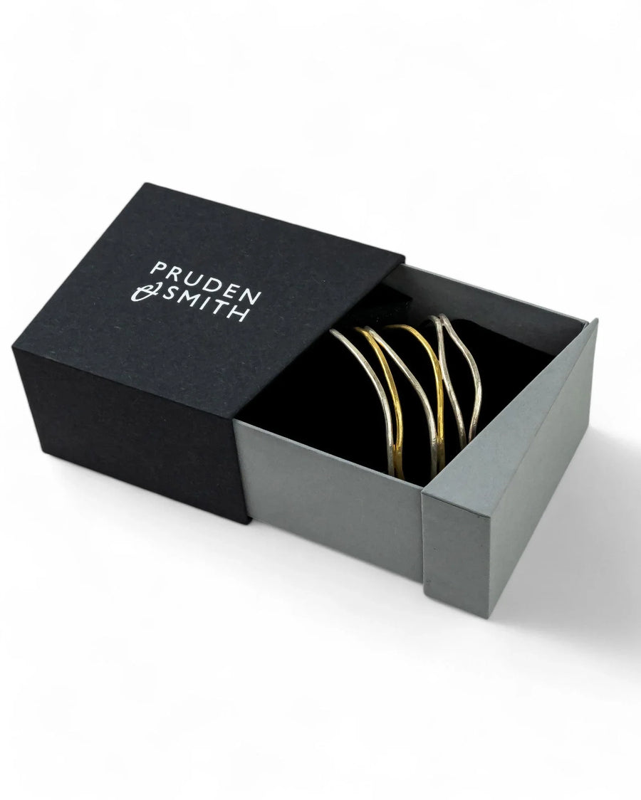 Six-strand silver and gold cuff bangle with organic design in a gift box