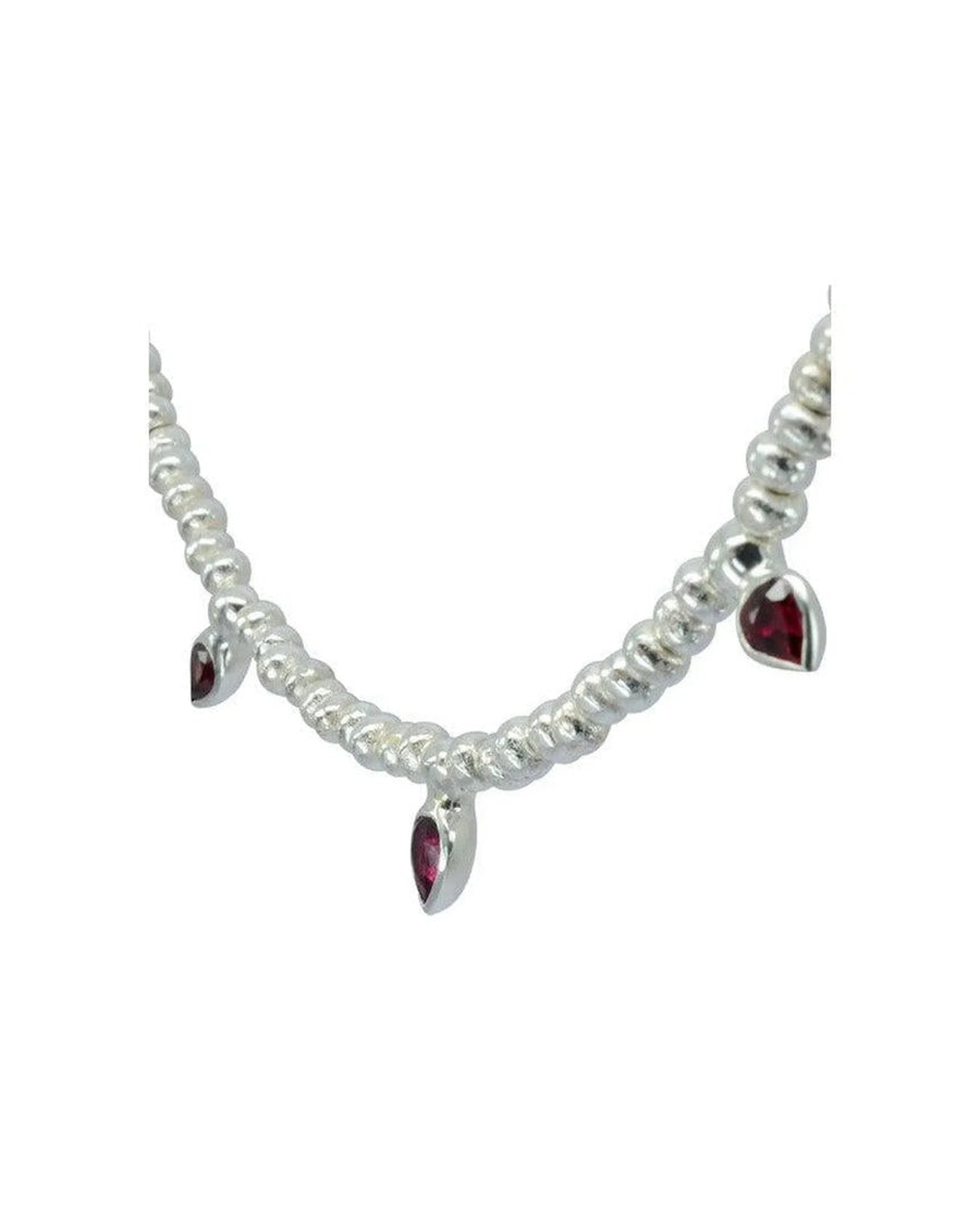 Silver nugget necklace with ruby drop pendants and organic textured design