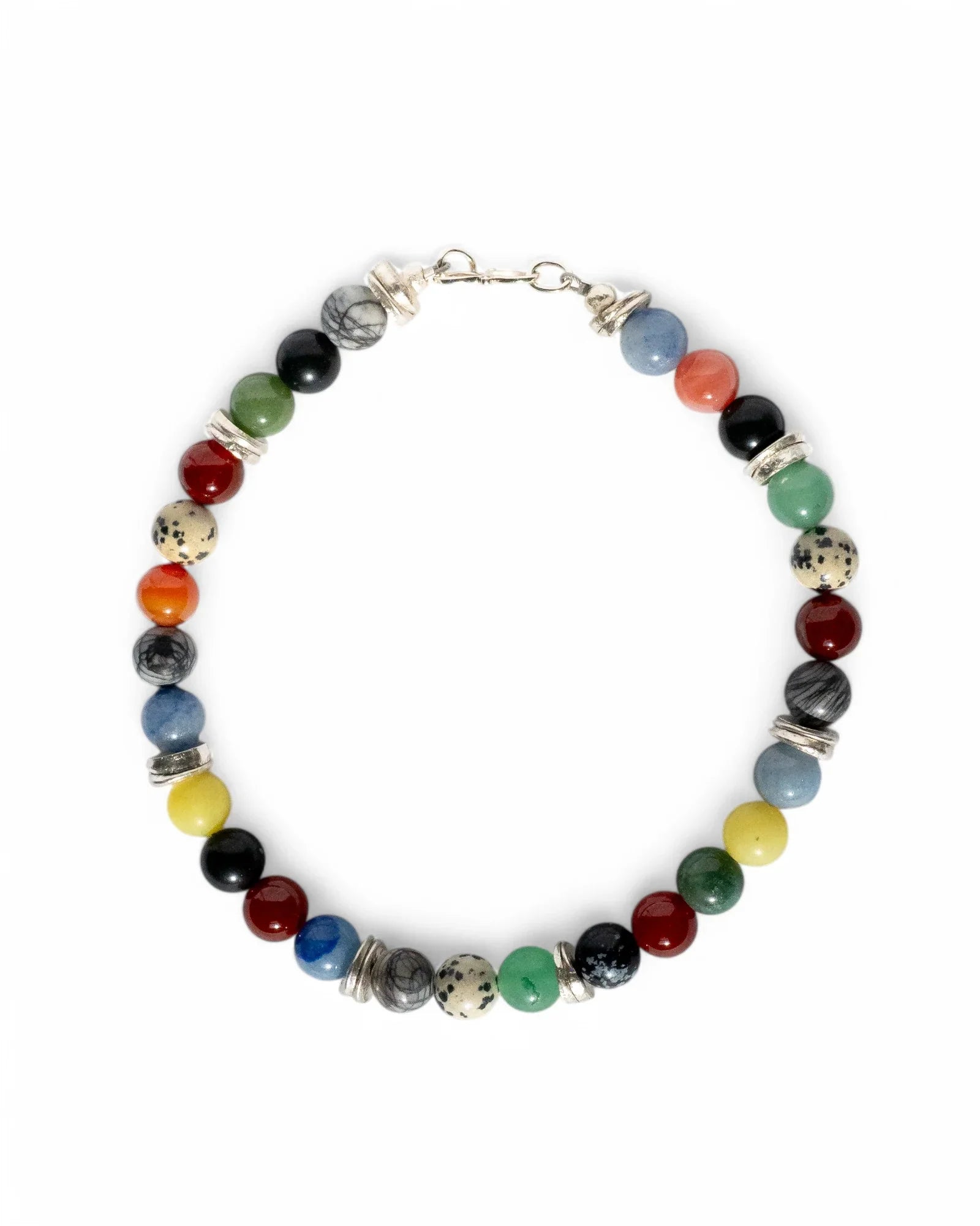 Handmade luxury beaded bracelet with multicoloured gemstones and silver spacers on white background