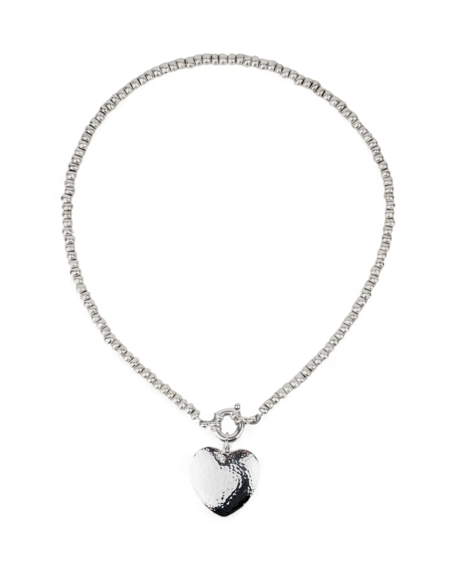 Silver nugget necklace with hammered heart pendant on white background