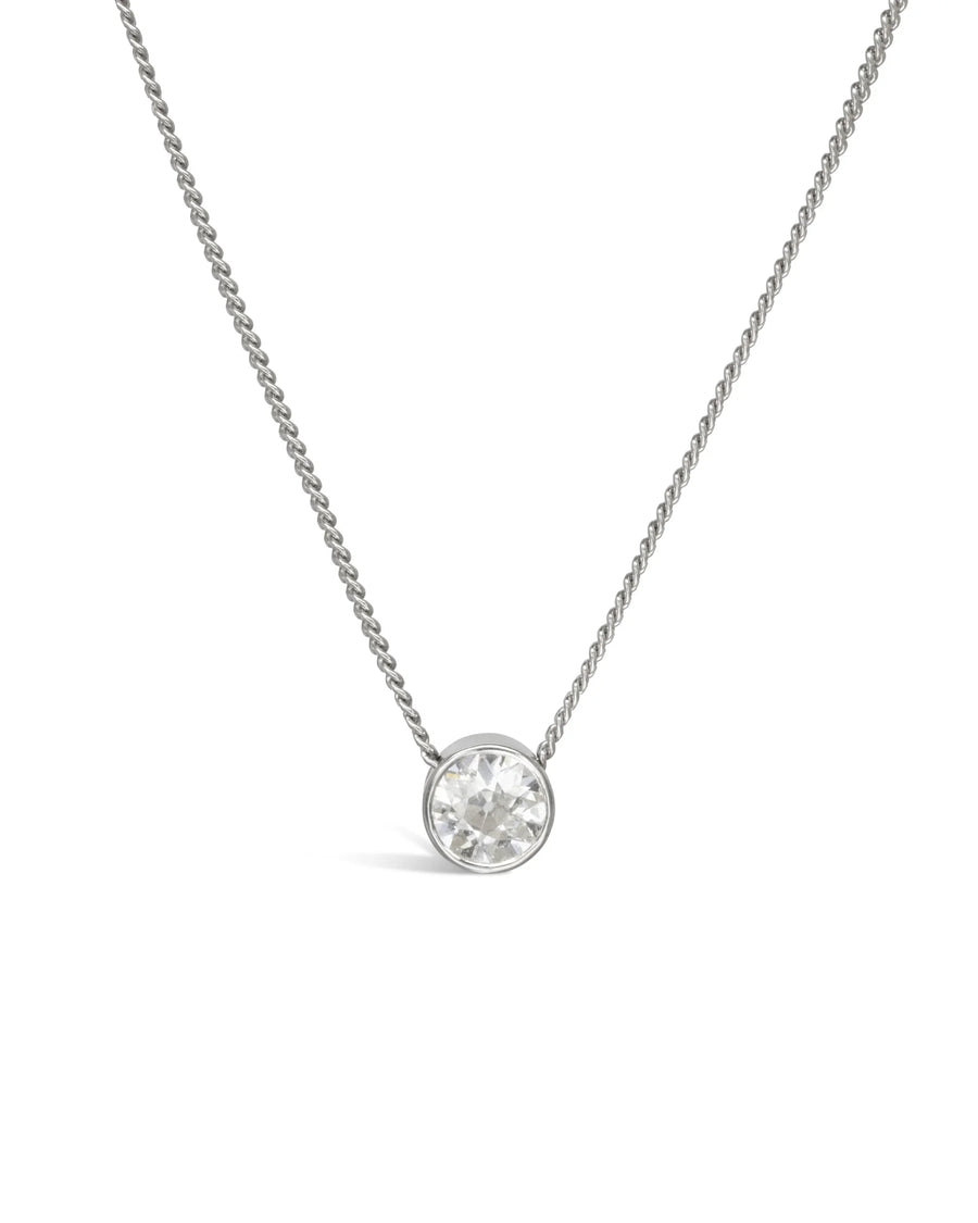 Round 1ct lab-grown diamond pendant in a bezel setting on a fine yellow gold chain.