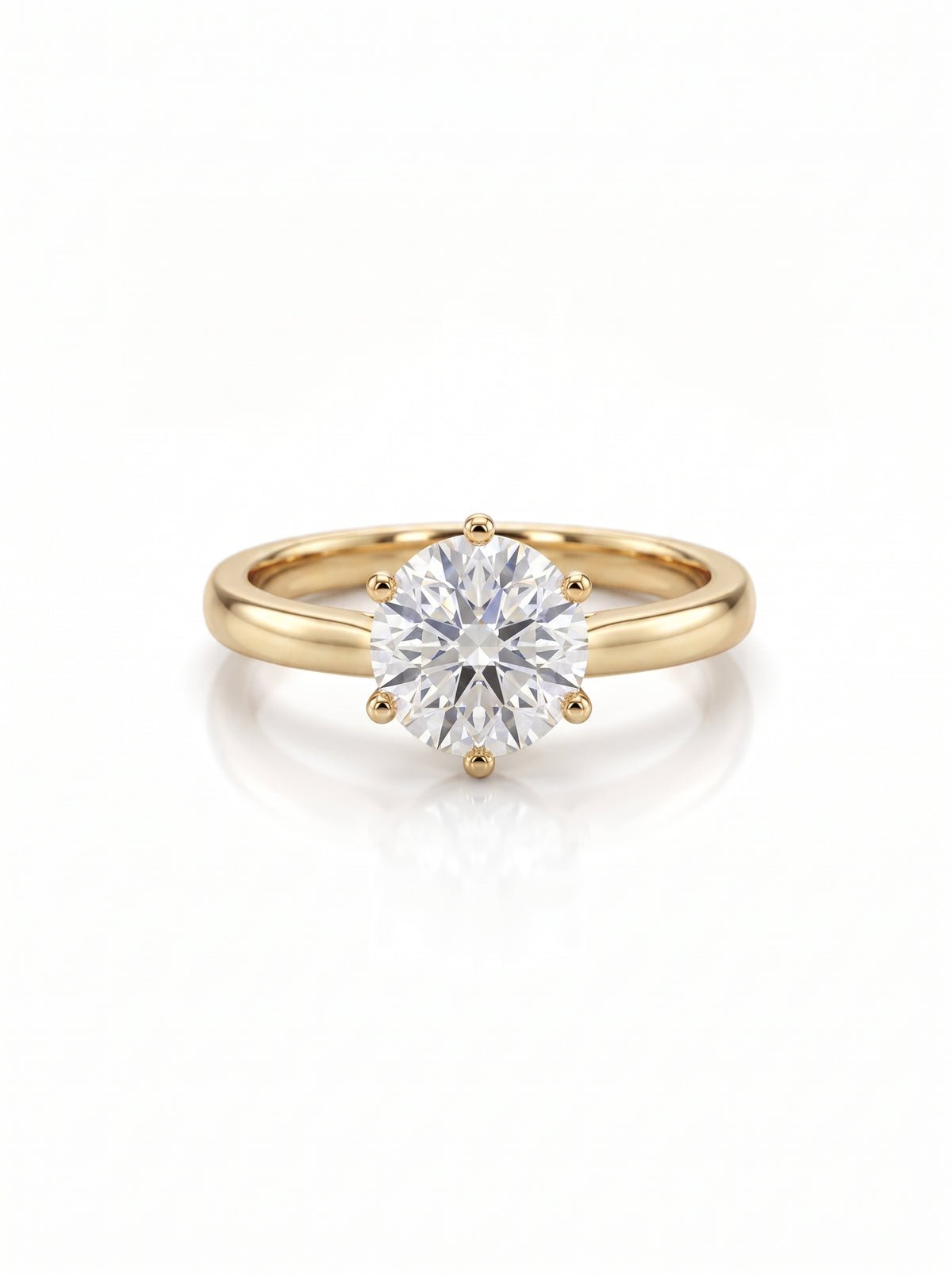 Round brilliant cut diamond engagement ring with a six-claw setting on a polished yellow gold band.