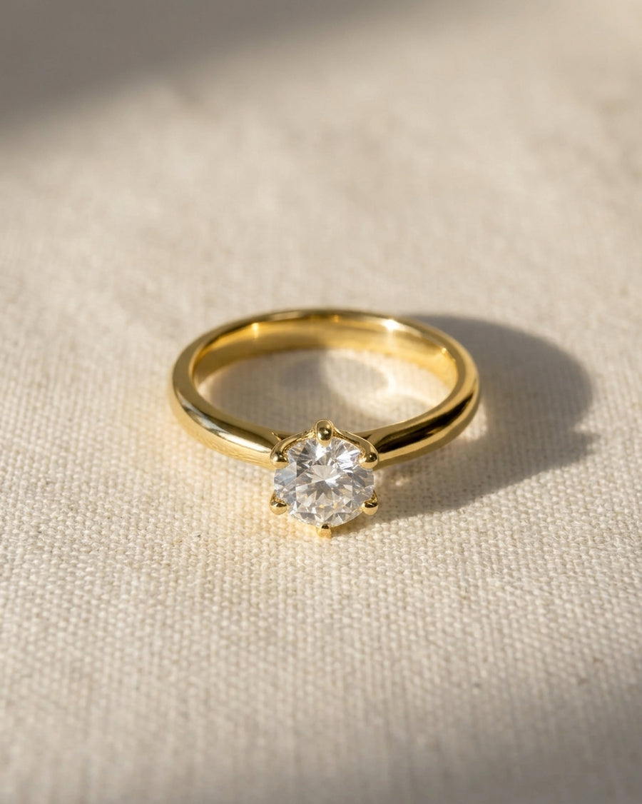 9ct yellow gold solitaire engagement ring with a round lab-grown diamond in a six-claw setting.