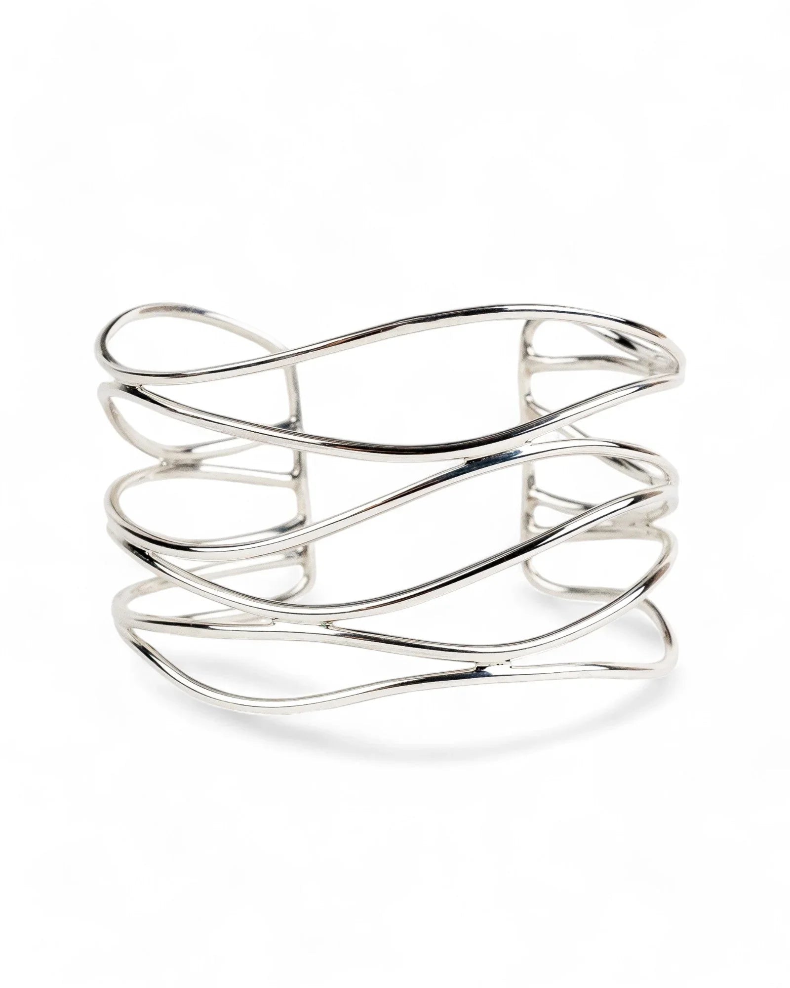 Wide solid silver cuff bangle with six flowing strands on a white background
