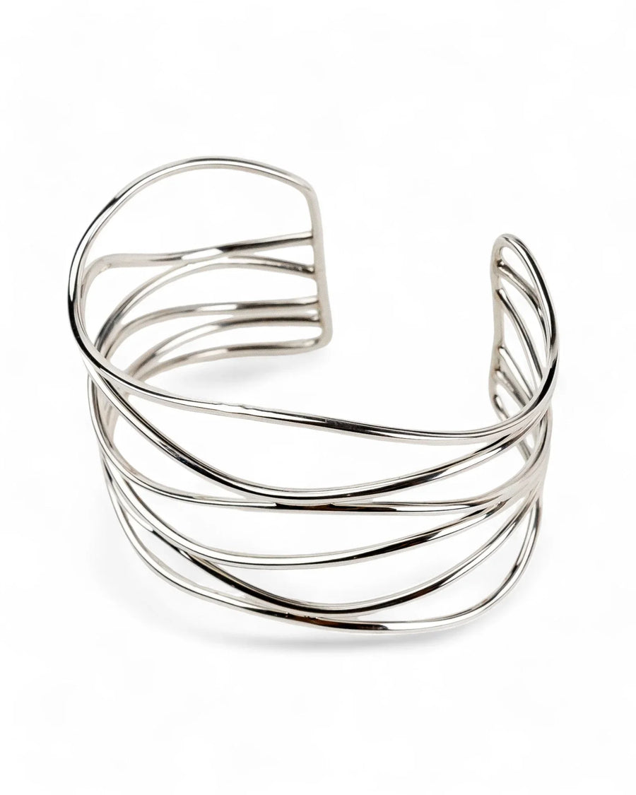 wide silver cuff bangle with six intertwining strands on white background