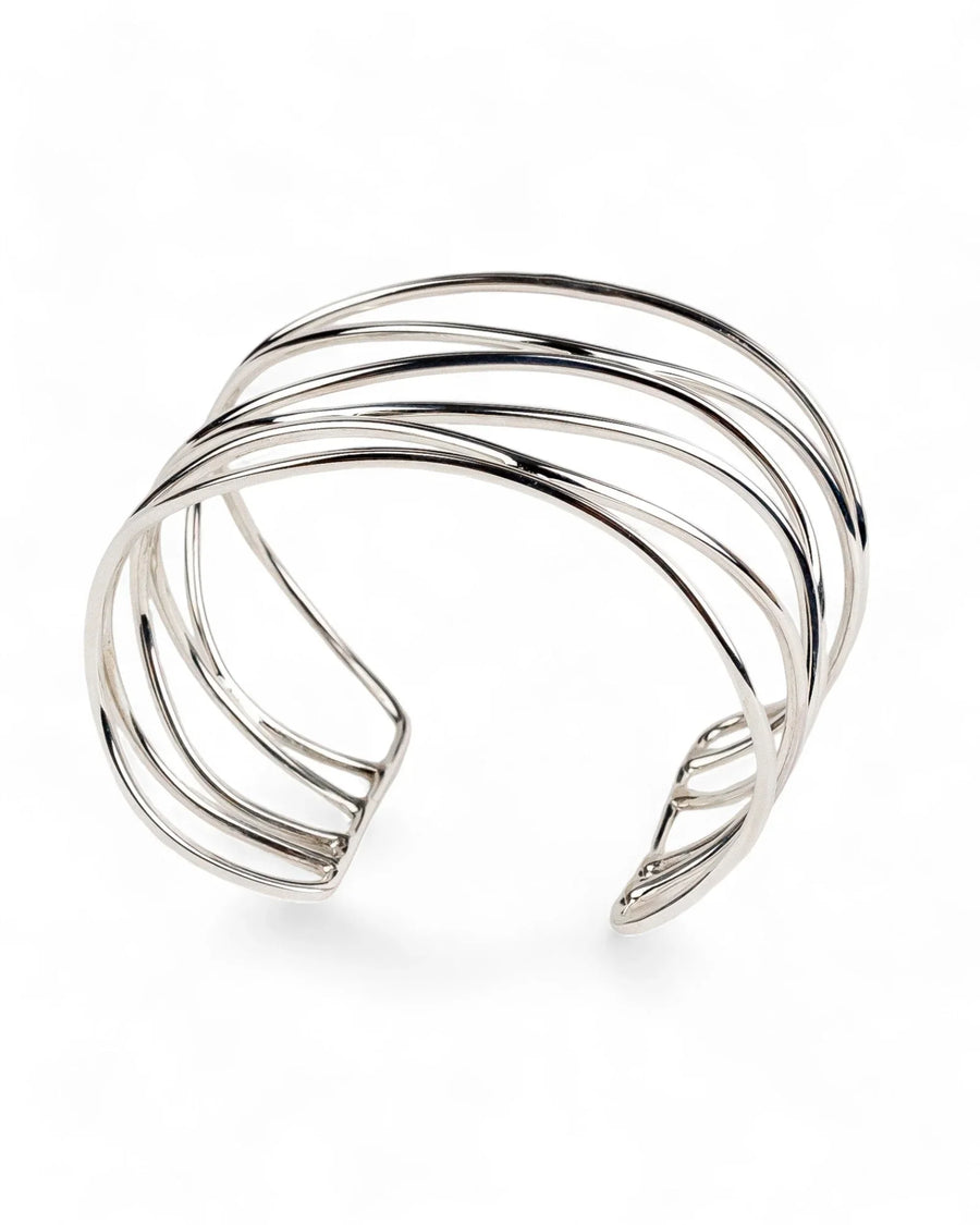 Wide six-strand solid silver cuff bangle with open geometric design on white background