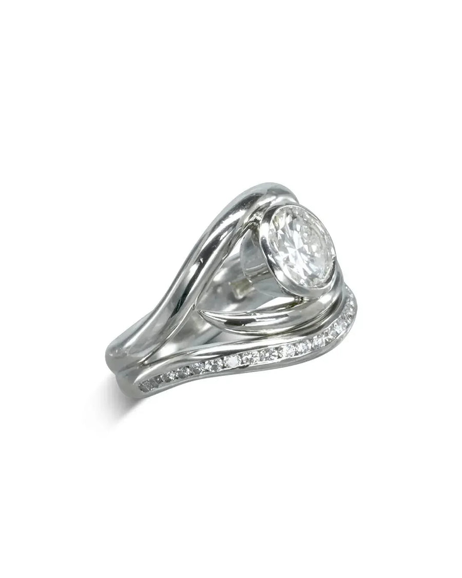 Silver engagement ring with a large oval diamond and a curved wedding band with small diamonds.