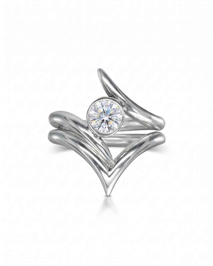 Silver spiky engagement and wishbone wedding ring set with a round diamond.